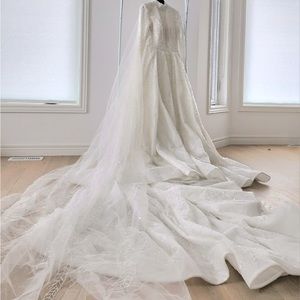 Never worn designer wedding dress